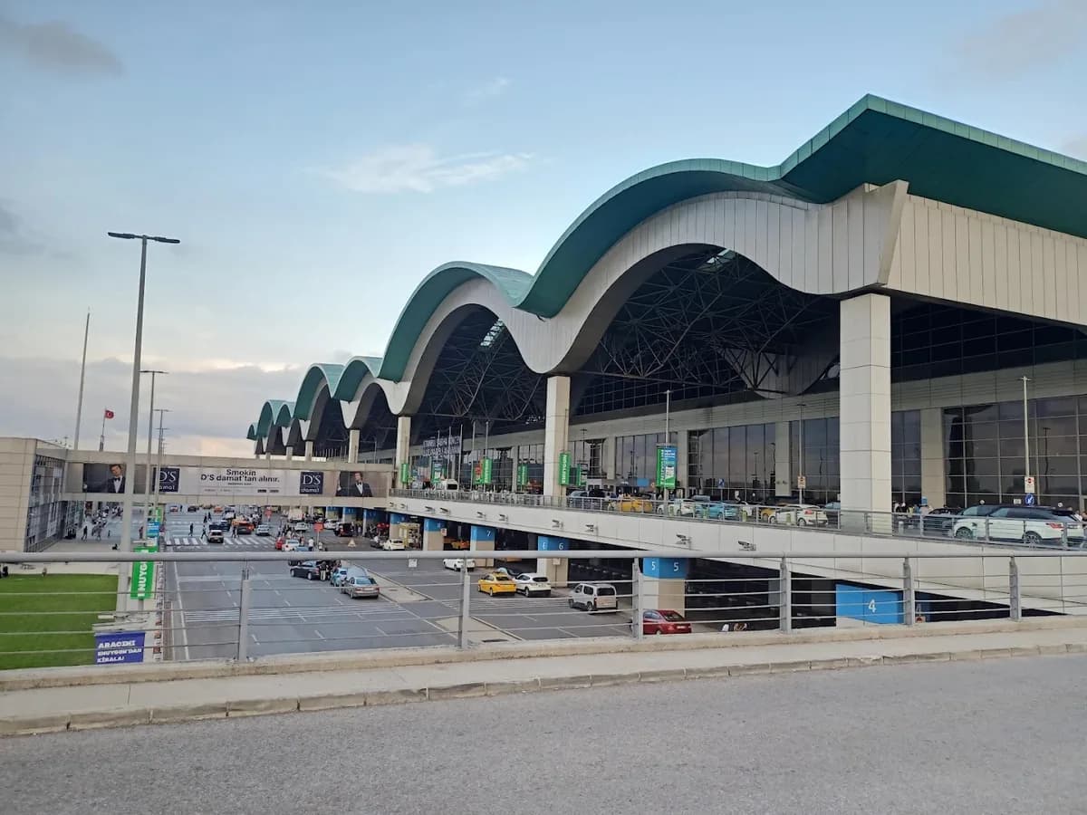 Sabiha Gökçen Airport terminal and forecourt with taxis and car park, parking rates 2026